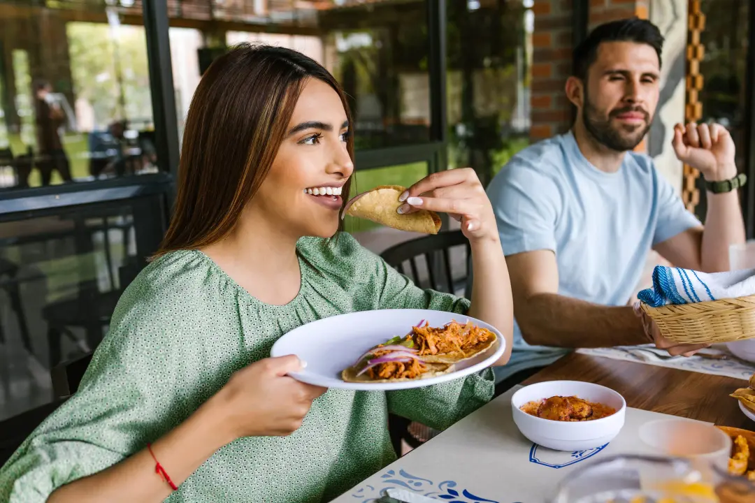 Person eating a taco