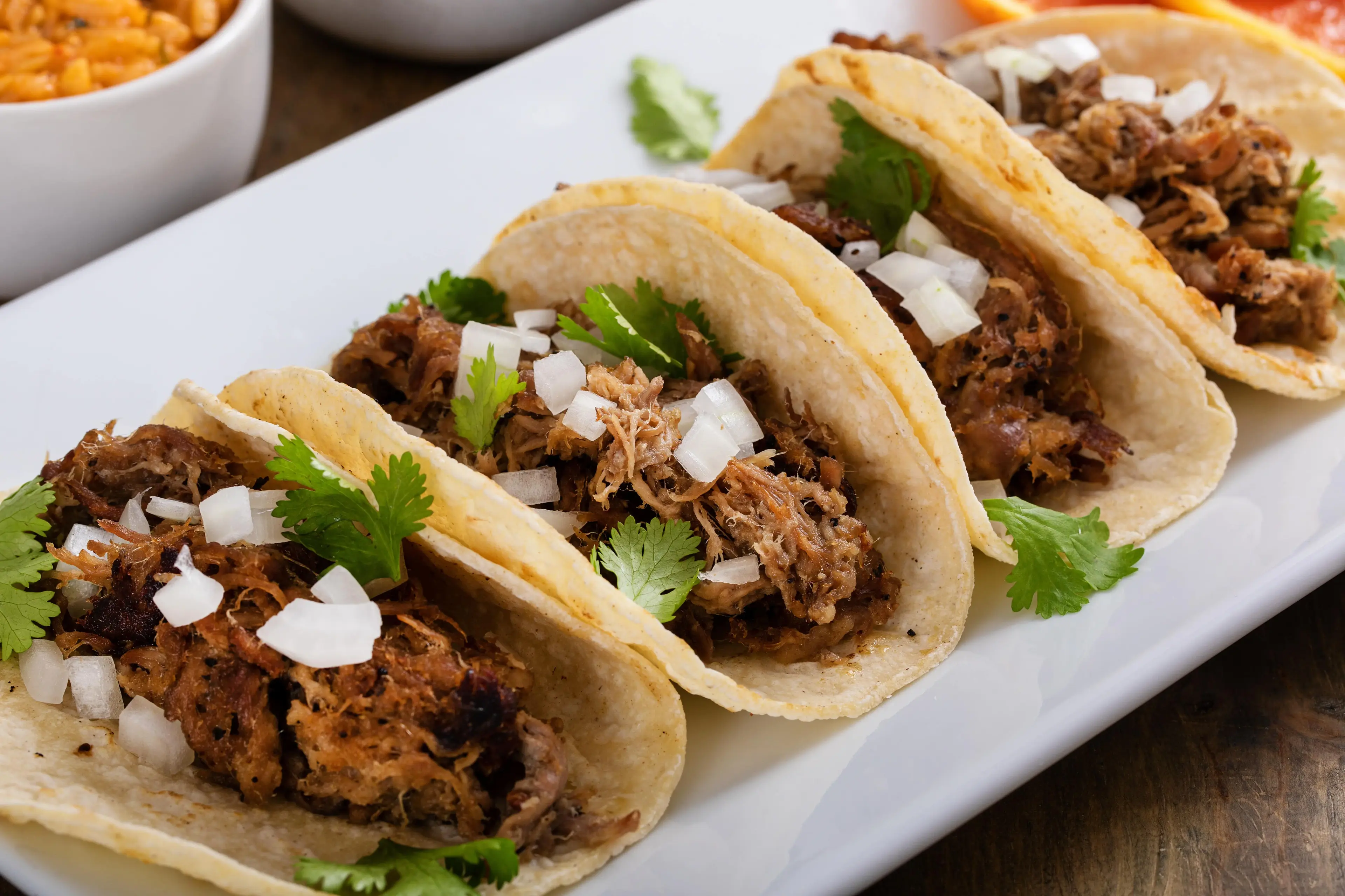 Four carnitas tacos